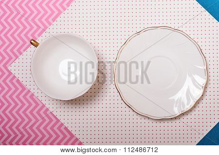 Cup And Saucer On A Colorful Background