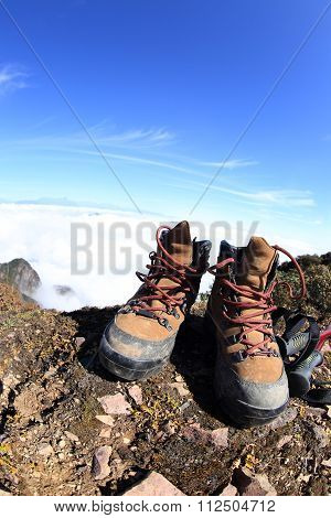 pair of hiking boots on beautiful mountain peak
