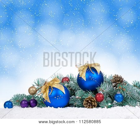 Christmas Baubles And Blue Balls With Snow Fir Tree