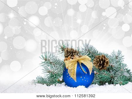 Christmas Baubles And Blue Balloon Over Snow Bokeh Background