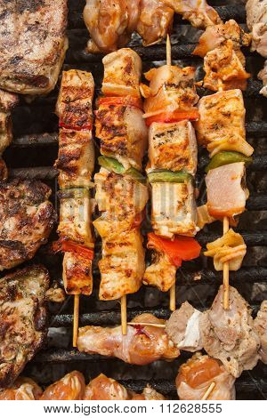 bbq meat with vegetables on stick fried on brazier