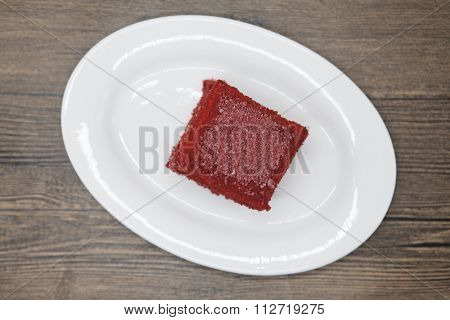 Red Velvet, fresh delicious diet cake  at Dukan Diet on a porcelain plate on a wooden background
