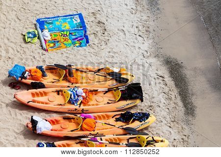 Top View Of Canoes At Tsigrado Beach In Milos Island, Cyclades, Greece