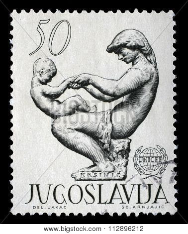 YUGOSLAVIA - CIRCA 1962: a stamp printed in Yugoslavia shows The 15th Anniversary of the UNICEF, circa 1962.
