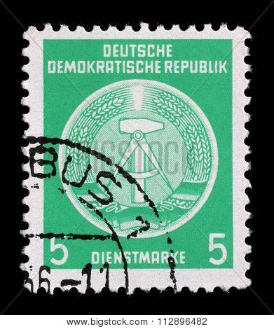 GDR - CIRCA 1952: A Stamp printed in GDR (German Democratic Republic - East Germany) shows DDR national coat of arms with inscription Service Stamp, series GDRs national coat of arms, circa 1952