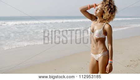 African-american woman relaxing on tropical beach in slow motion