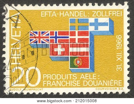 MOSCOW RUSSIA - CIRCA OCTOBER 2017: a post stamp printed in SWITZERLAND shows lags of the participating countries the series "E.F.T.A." circa 1967