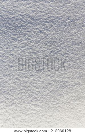 light and shadow on a snowy background, beautiful detailed urface with crystals of snowflakes, close-up