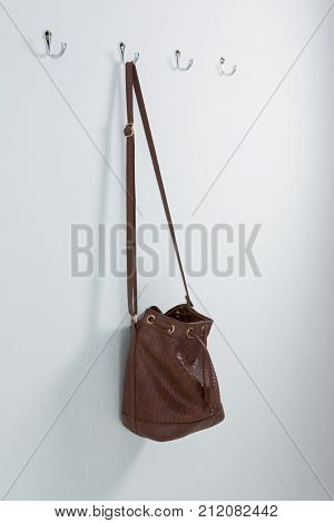 Bag hanging on hook against wall