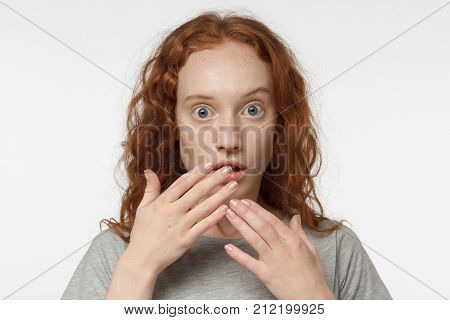 Horizontal Closeup Photo Of Young Redhead European Female Isolated On White Background Dressed In Ca