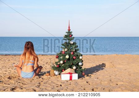 girl on Christmas vacation on a beach resort 1