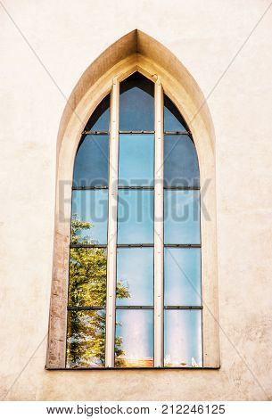 Old window with reflections Spilberk castle Brno southern Moravia Czech republic. Architectural element. Yellow photo filter.