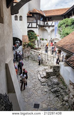 Bran, Romania - September 7, 2017: Tourists visit inside part of Bran or Dracula Castle in Transylvania, Romania.