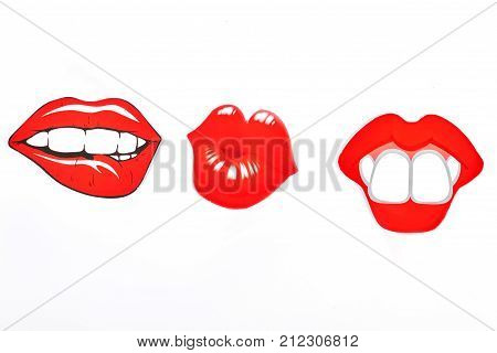 Female fake lips, white background. Three paper fake lips isolated on white background. Girls party concept.