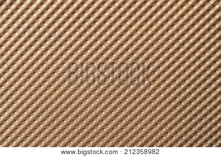 Metallic bronze colored background with chased structure