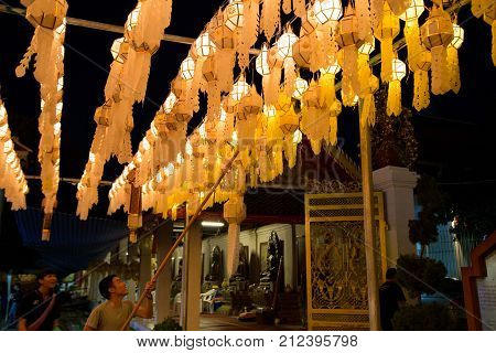 Lamphun Thailand - October 27 2017: Buddhist decorating Yee Peng lantern in Wat Phra That Hariphunchai