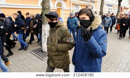 Orel, Russia, November 4, 2017: Unity Day  Demonstration. Young People Hiding Their Faces And Showin