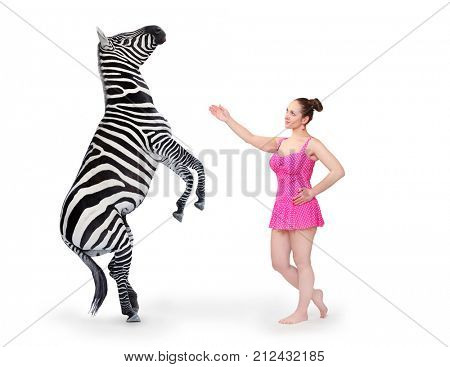 Show girl performing with Zebra on white background.