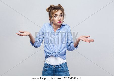 Negative Human Emotions, Facial Expressions. Puzzled Young Adult Woman With Arms Out, Shrugging Her