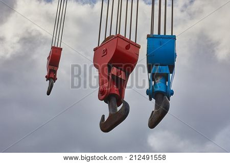 Heavy old steel hooks in a porr
