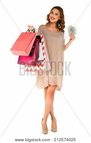 Smiling Woman In Dress Holding Money Posing With Shopping Bags
