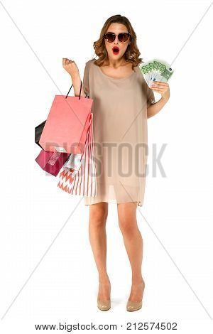 Shoked Woman Holding Money Euro, Posing With Shopping Bags And Looking At Camera.
