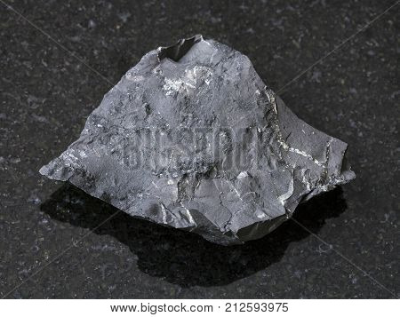 Raw Shungite Shale Stone On Dark Background