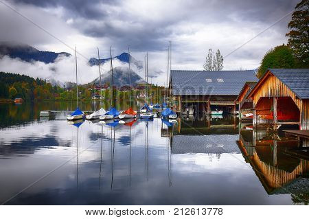 Yacht dock on the lake. Misty morning on the lake Grundlsee Location: resort Grundlsee Liezen District of Styria Austria Alps. Europe.