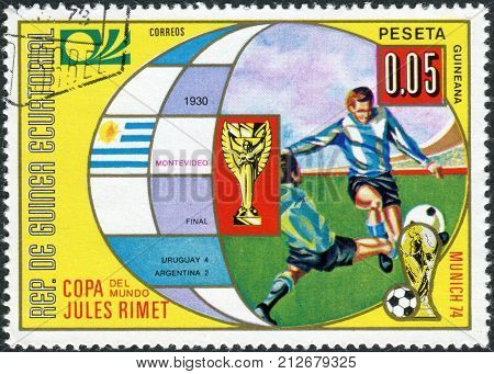 EQUATORIAL GUINEA - CIRCA 1973: Postage stamp printed in Equatorial Guinea is dedicated to Football World Cup 1974 Germany shows the final 1930 Montevideo circa 1973