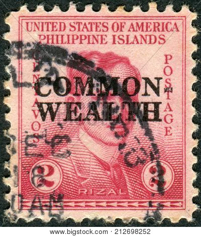 PHILIPPINES - CIRCA 1935: Postage stamp printed in the Philippines (overprint dedicated 1st anniviversary of the Commonwealth) shows a portrait of a Filipino nationalist writer and revolutionary Jose Rizal circa 1935