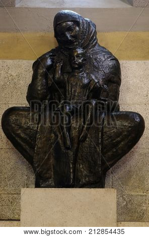 ZAGREB, CROATIA - AUGUST 19: Virgin Mary with baby Jesus sculpture by Ivan Mestrovic, church of St. Mark in Zagreb, Croatia on August 19, 2017.