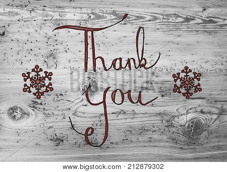 Black English Calligraphy Thank You. Gray Vintage Wooden Background