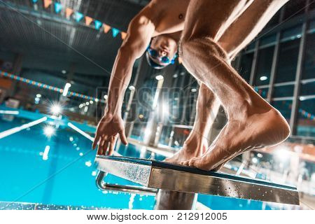 Swimmer Jumping Into Pool