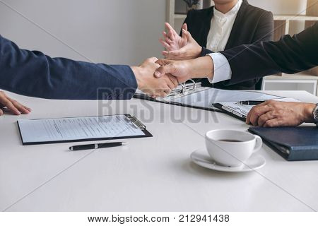 greeting new colleagues Handshake while job interviewing male candidate shaking hands with Interviewer or employer after a job interview employment and recruitment concept.