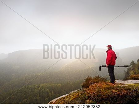 Nature Photographer Prepare Camera To Takes Impressive Photos Of Misty Fall Mountains. Tourist Photo
