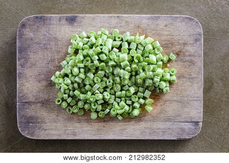 Sliced yard long bean vegetable on wooden block.long bean preparation in thai kitchen.