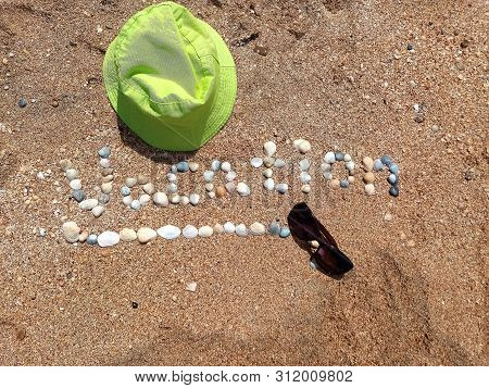 Beautiful Vacation Sign Formed With The Shells And The Panama Hat With Singlasses