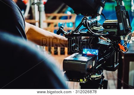 Behind The Scene. Cameraman Shooting Film Scene With Camera