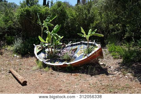 Old Marine Boat Used As Flowerpot. Old Boat.