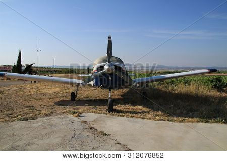 Ontur, Murcia, Spain- June 22, 2019: White And Blue Aircraft Parked In Aerodrome In A Sunny Day Of S