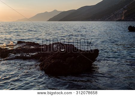 Beautiful Sunset With Rocks In The Adriatic Sea, Dingac Borak, Dalmatia, Croatia, Peljesac Peninsula
