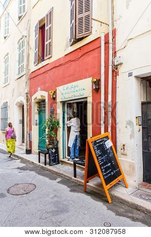 Marseille, France - September 8th 2015: A Woman Walks Past A Small Restuarant,. The Old Port Area Ha