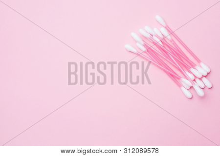 Pink Cotton Buds On Pink Background. Selective Focus Copy Space.