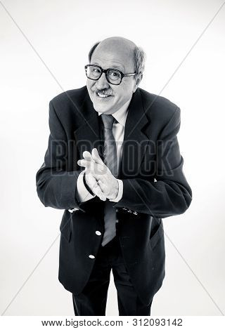 Full Body Portrait Of A Cheerful Delighted Senior Businessman Rubbing His Hands In Happiness At Last