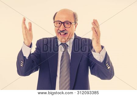 Portrait Of Happy Senior Businessman Celebrating Successes Of Great Idea
