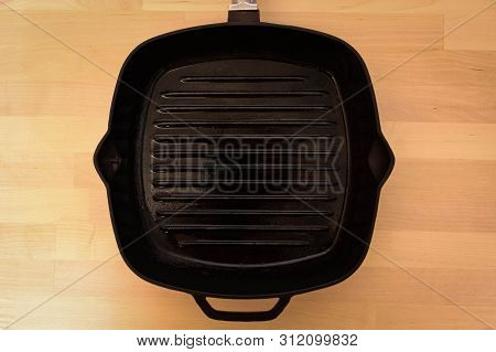Fat-less Pan On Wooden Background, Top View