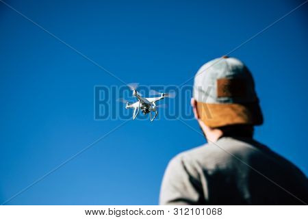 Man Playing With Drone On The Open Field