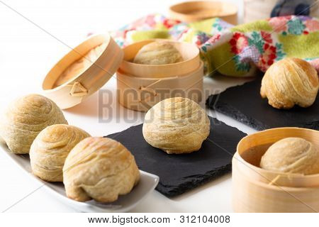 Oriental Food Concept Homemade Organic Huaiyang Spiral Chinese Flaky  Pastry Moon Cake On White Back