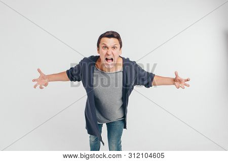 Portrait Of A Man Who Screams. Isolated On White Background. Concept Of Freedom Of Expression Of Fee
