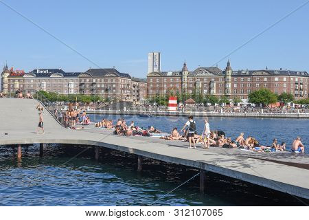 People Sunbathing In The Center Of Copenhagen On Denmark